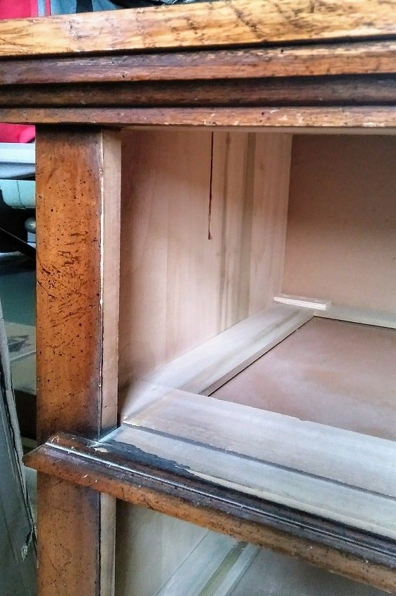 closeup of dresser drawer interior and orange finish