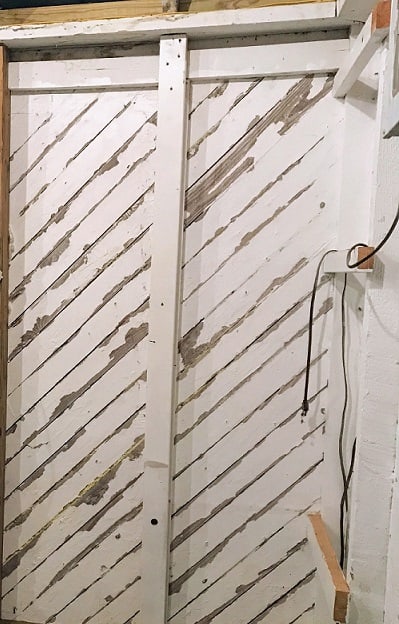 wood slat wall with gaps between boards