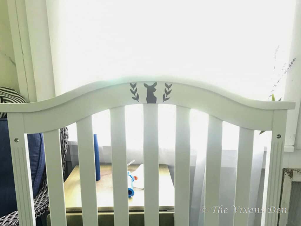 painted crib headboard with deer stencil