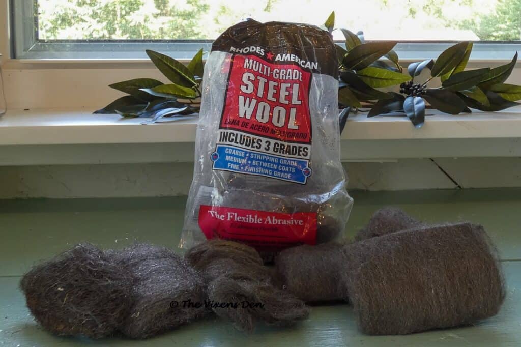 a bag of Rhodes Steel Wool pads with all three grades lined up in front
