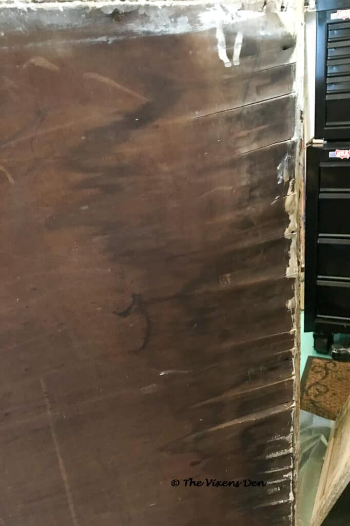 cabinet back with significant water damage
