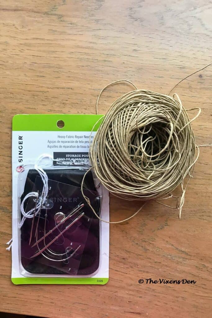 set of upholstery repair needles and a round of hemp cord