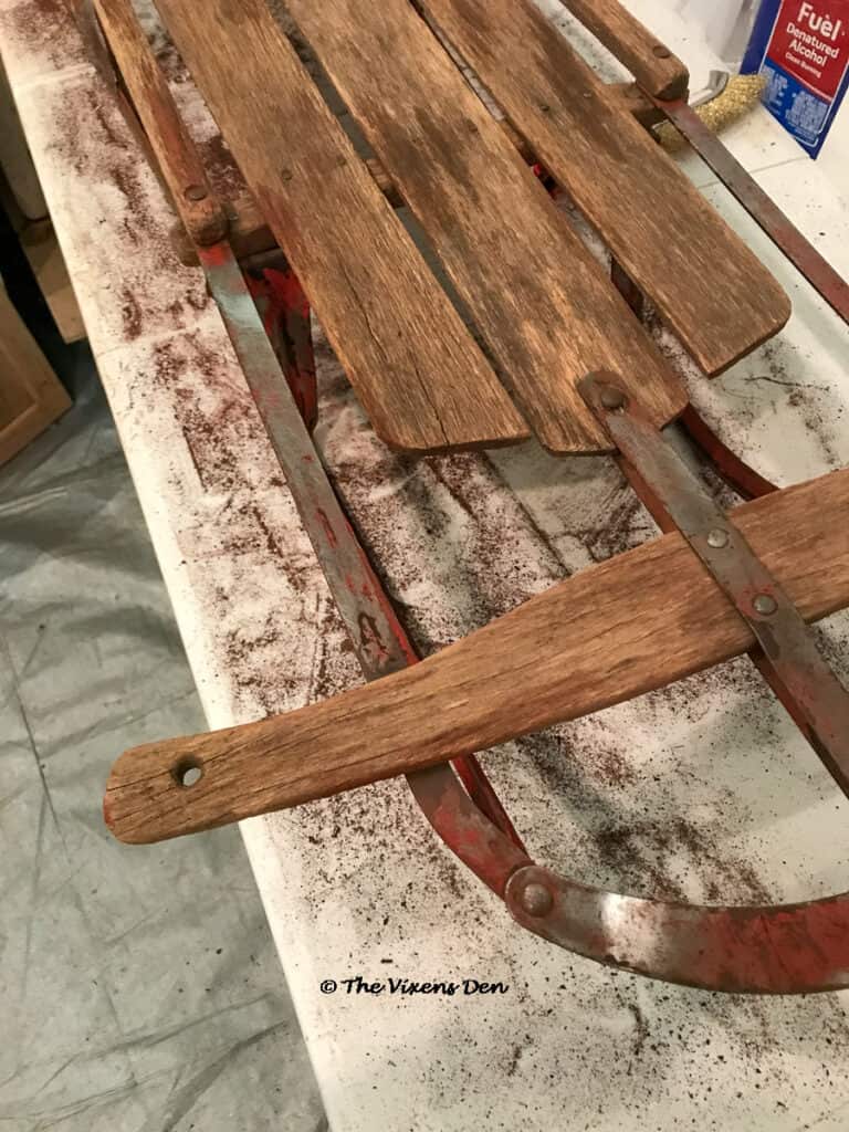 vintage sled runner after being wire brushed with wire brush wheel