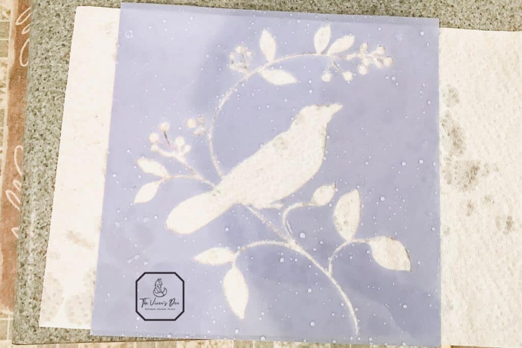 bird in a bush stencil drying on a paper towel