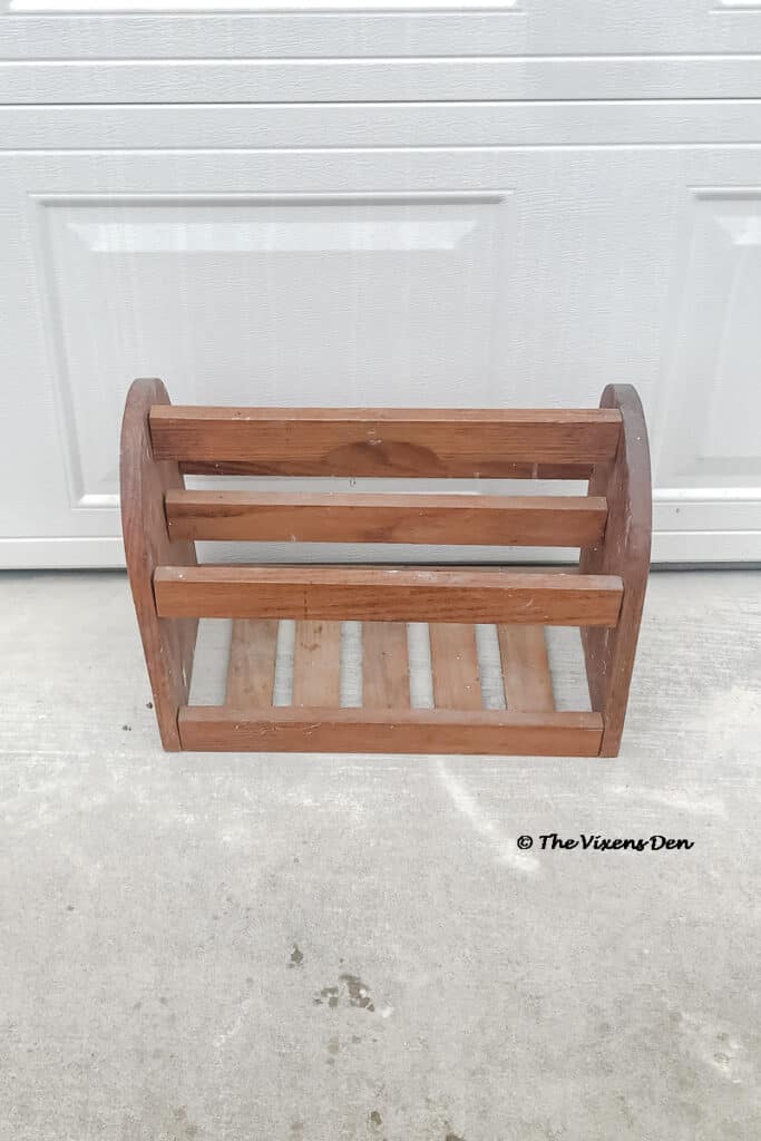 magazine rack before painting and repurposing