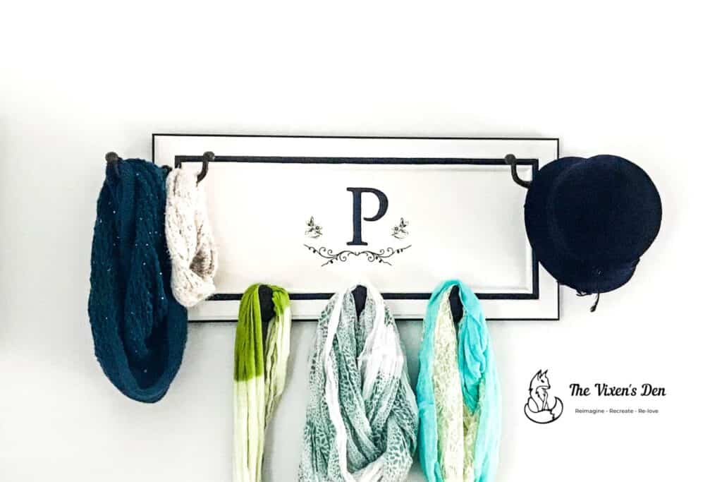 upcycled cabinet door to a scarf rack