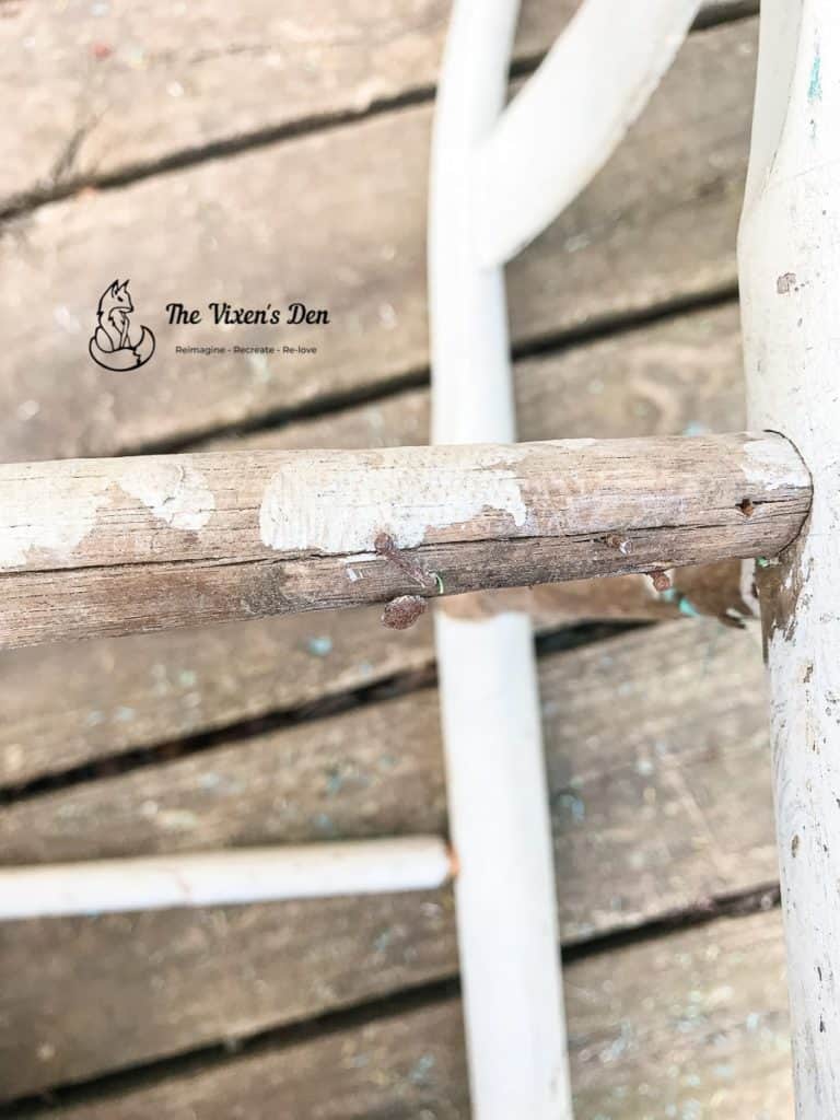 rusted tacks on a ladderback chair