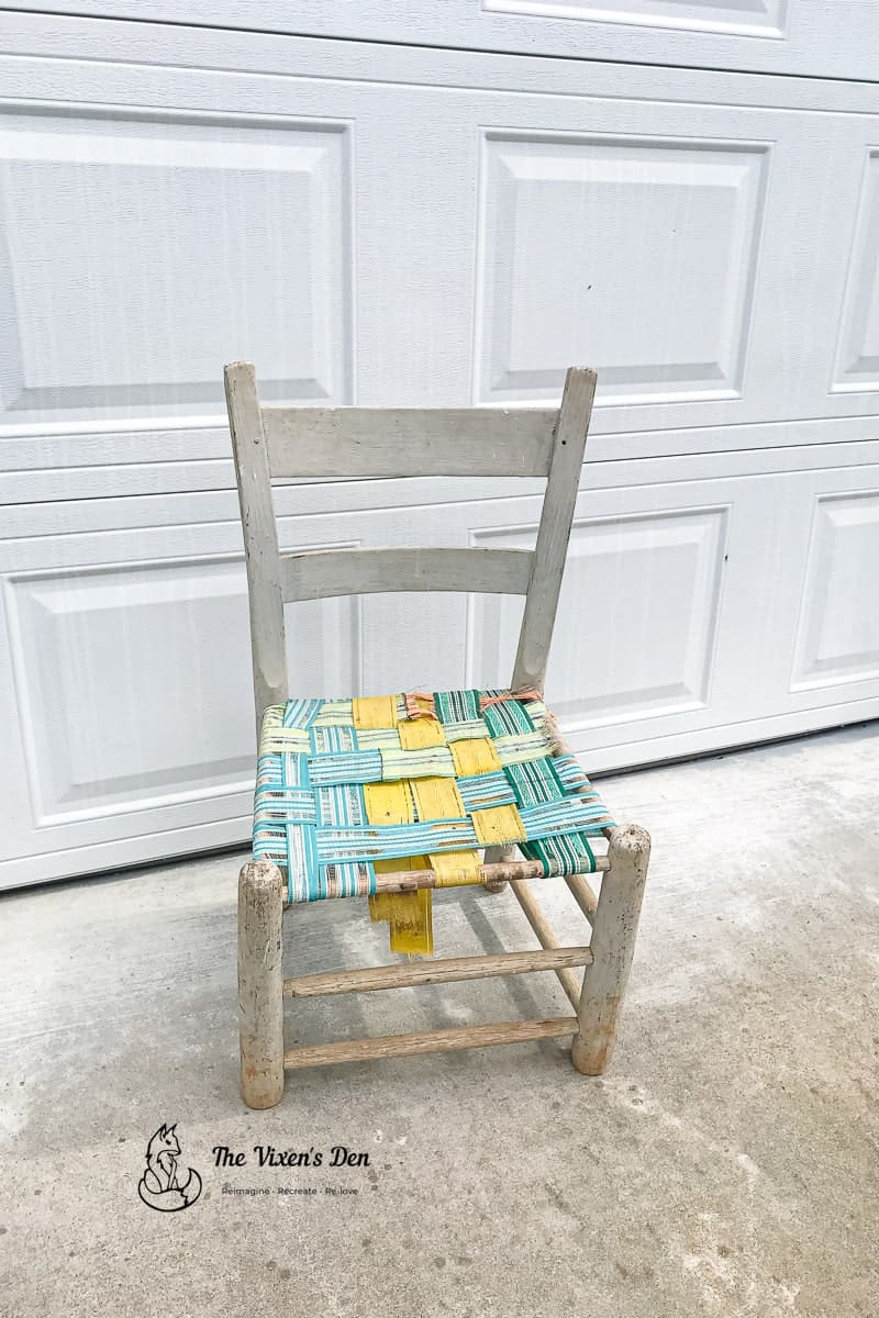 ladderback chair with decaying webbing seat