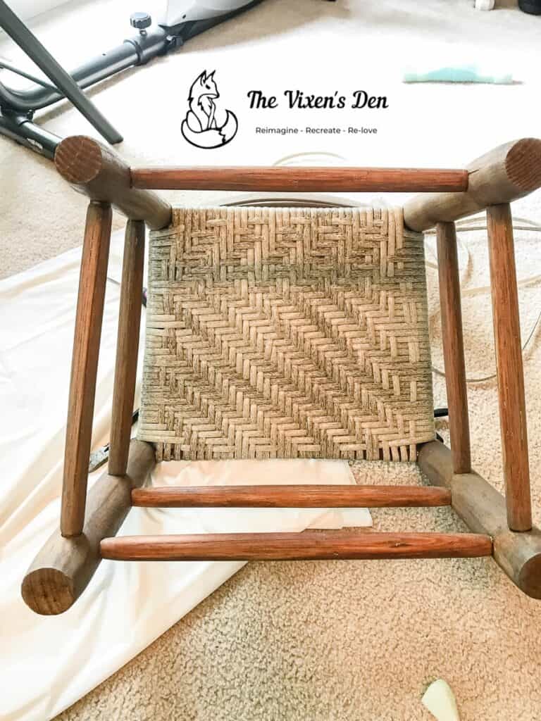 bottom of a woven faux rattan flat reed chair seat-min