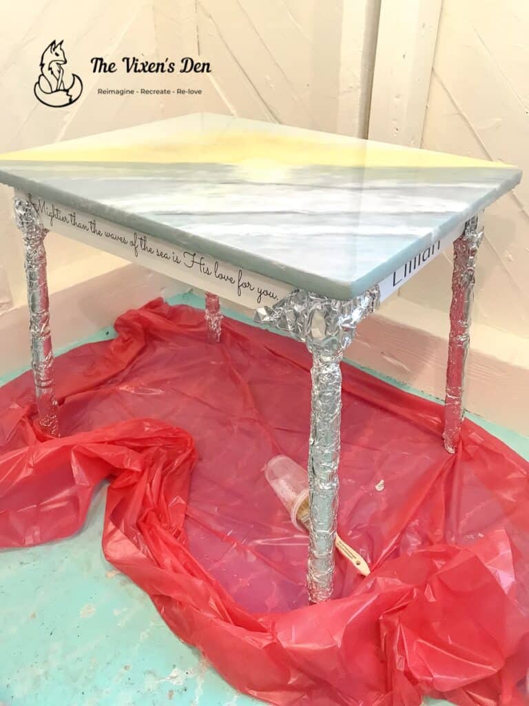 chalk painted table with a resin sealed table top and legs wrapped in aluminum foil-min