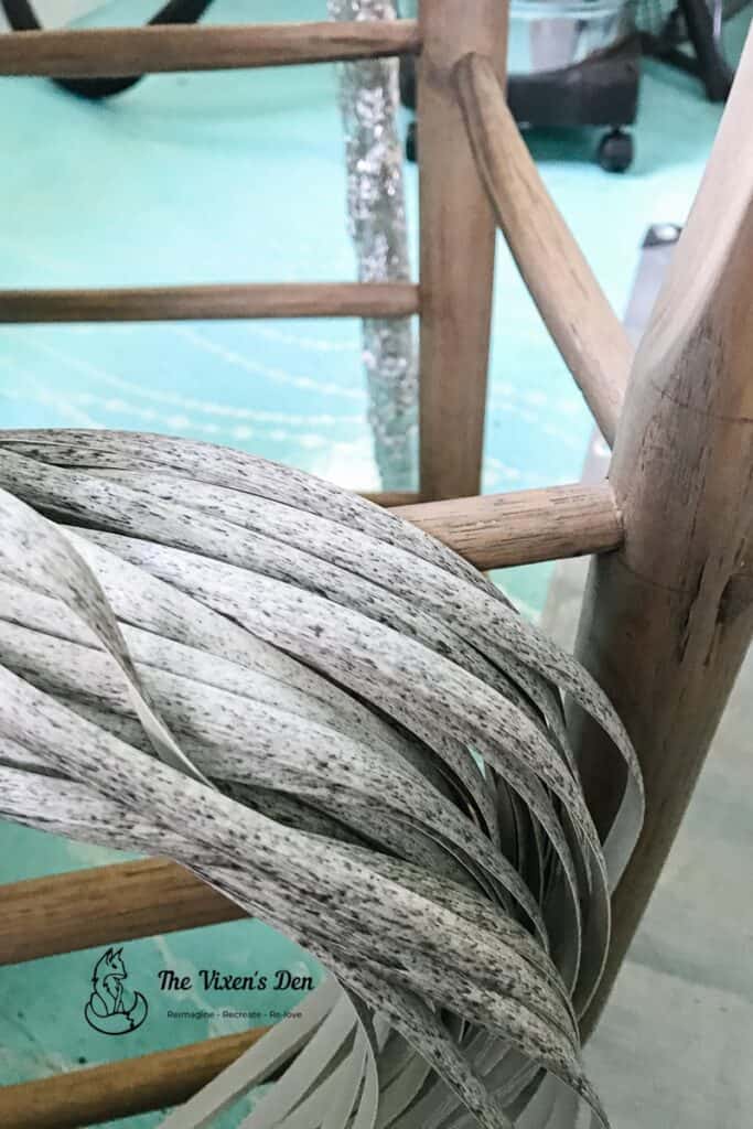 faux rattan flat reed draped across a ladderback chair rail