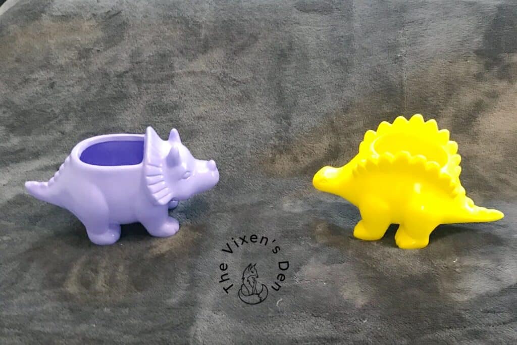 lavender and yellow ceramic dinosaurs