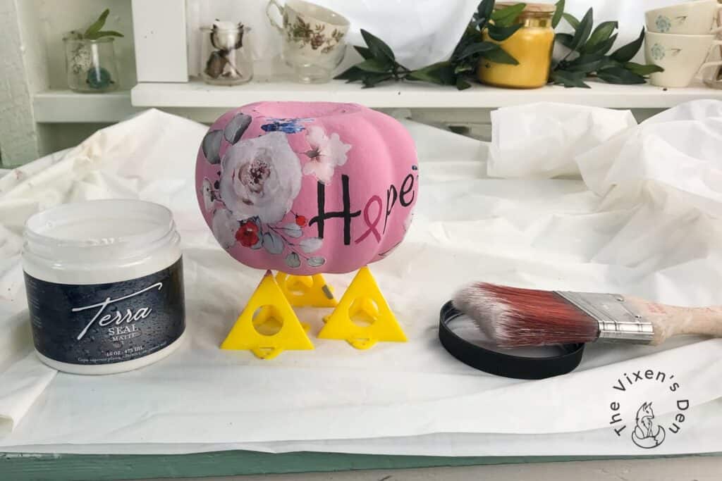Breast Cancer Pumpkin with Terra Seal and a paintbrush
