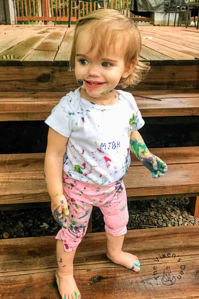 Toddler with paint splatters