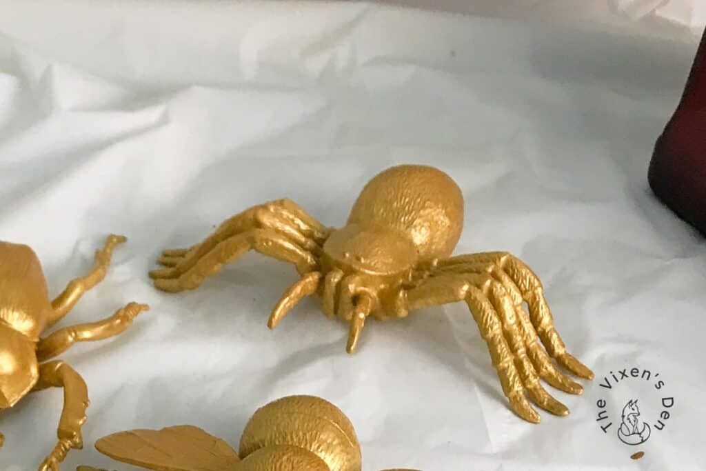 process - closeup of gold spider painted with Moonshine Metallics in Golddigger