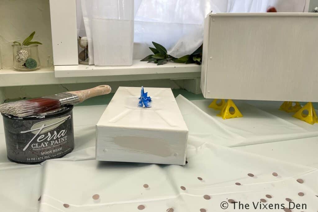 Metal File Box with Jar of Terra Clay Paint and a Paintbrush