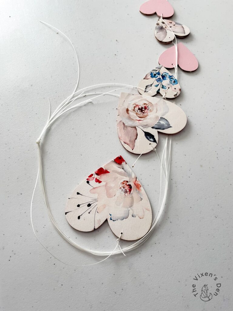 Valentine's Heart Charms with cords tied together in a knot