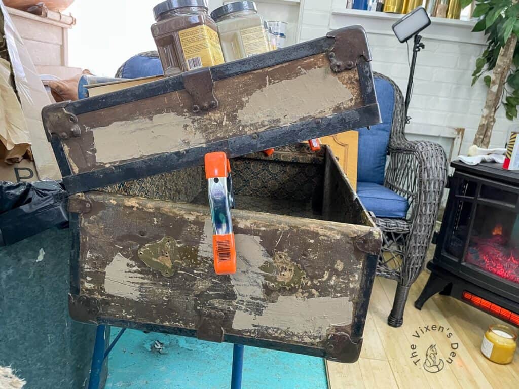 Old Wood Trunk Makeover-sideview of clamped trunk while making repairs