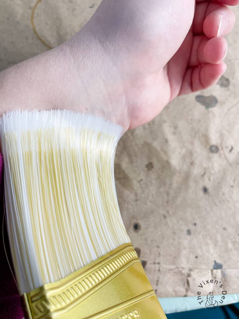 Testing Paintbrush Bristle Softness Against My Wrist