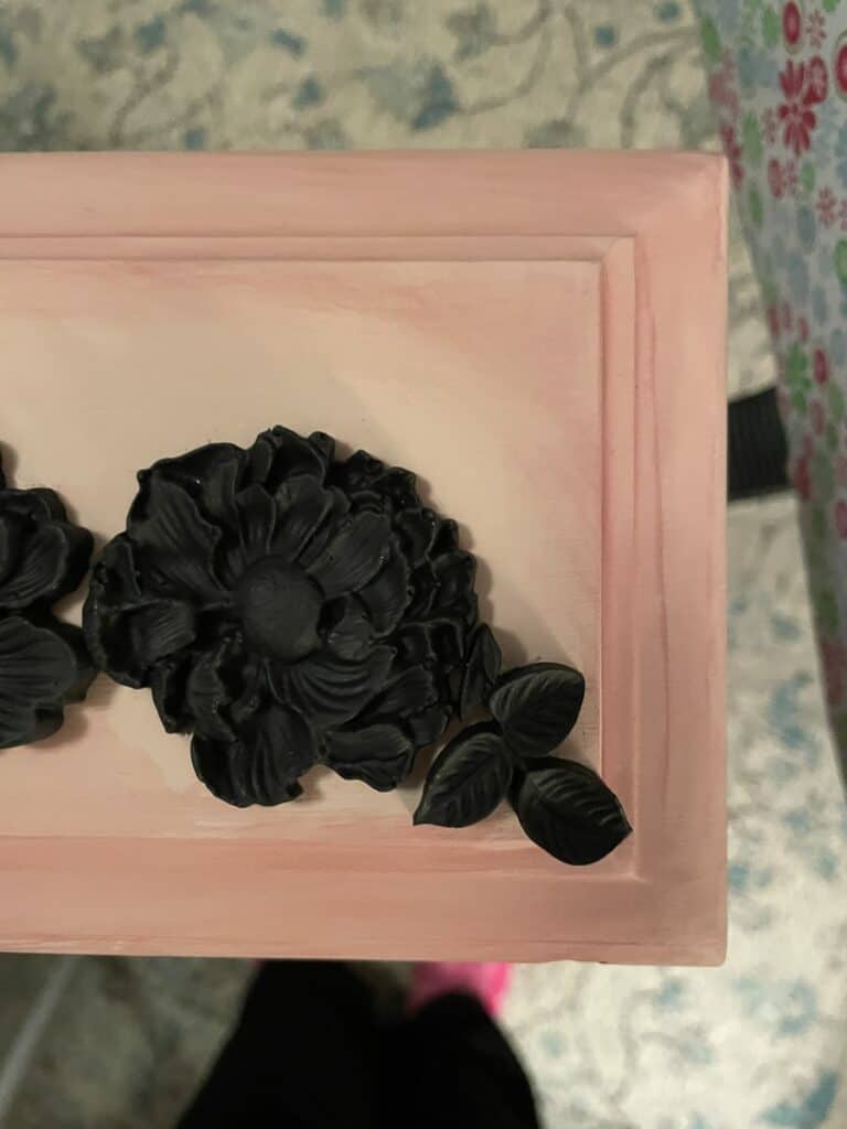 Resin appliques painted black and applied to pink drawer front