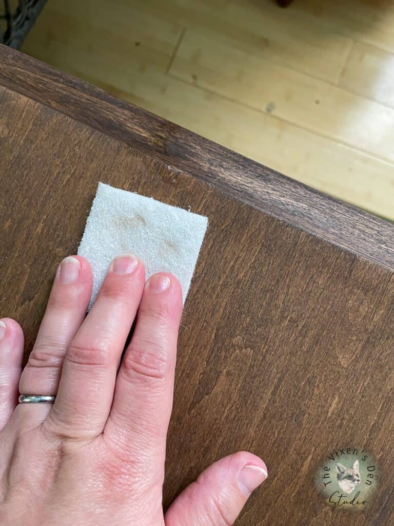 Rubbing out burn in veneer repair with buffing pad