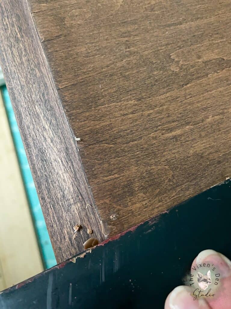 Scraping off excess burn in wood filler (2)