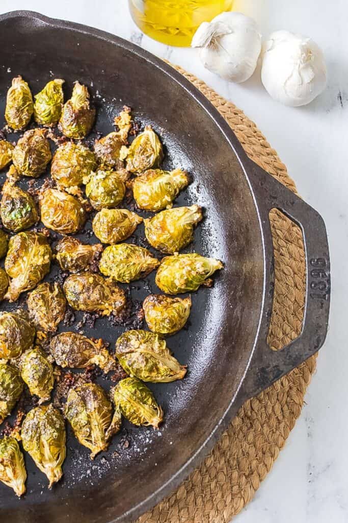 Roasted brussels sprouts in a skillet.