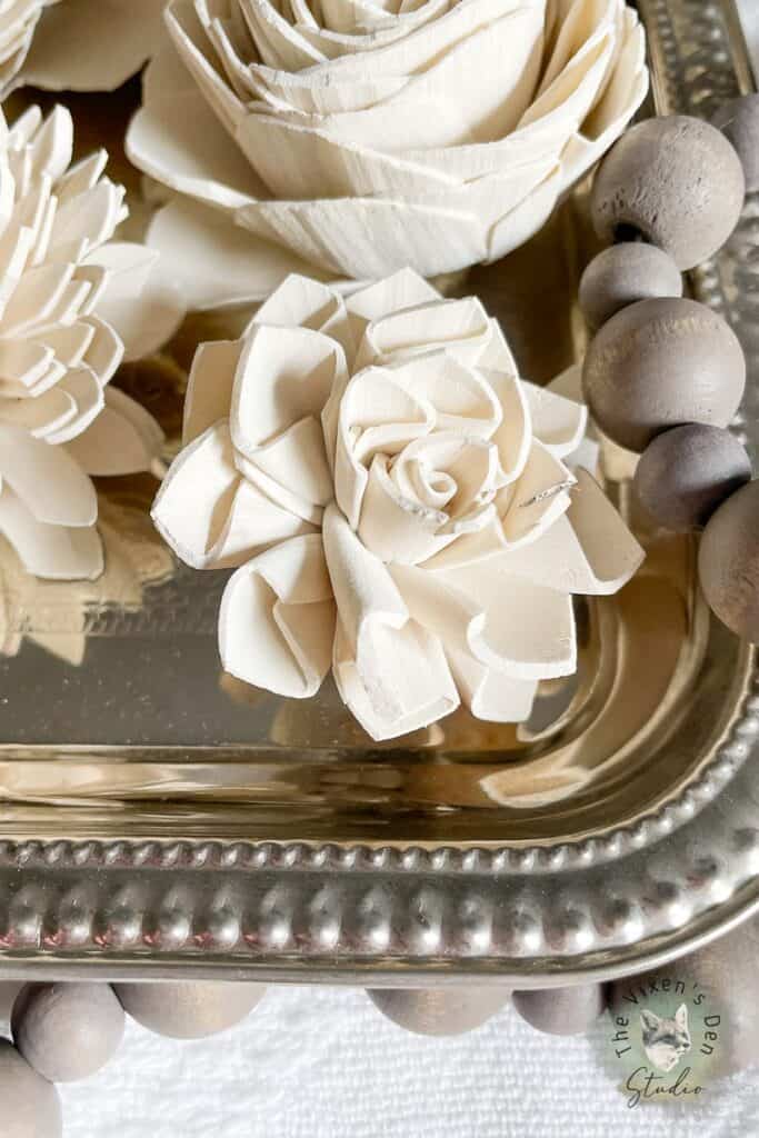 Closeup of dyed Sola Wood Flowers on a silver tray.1