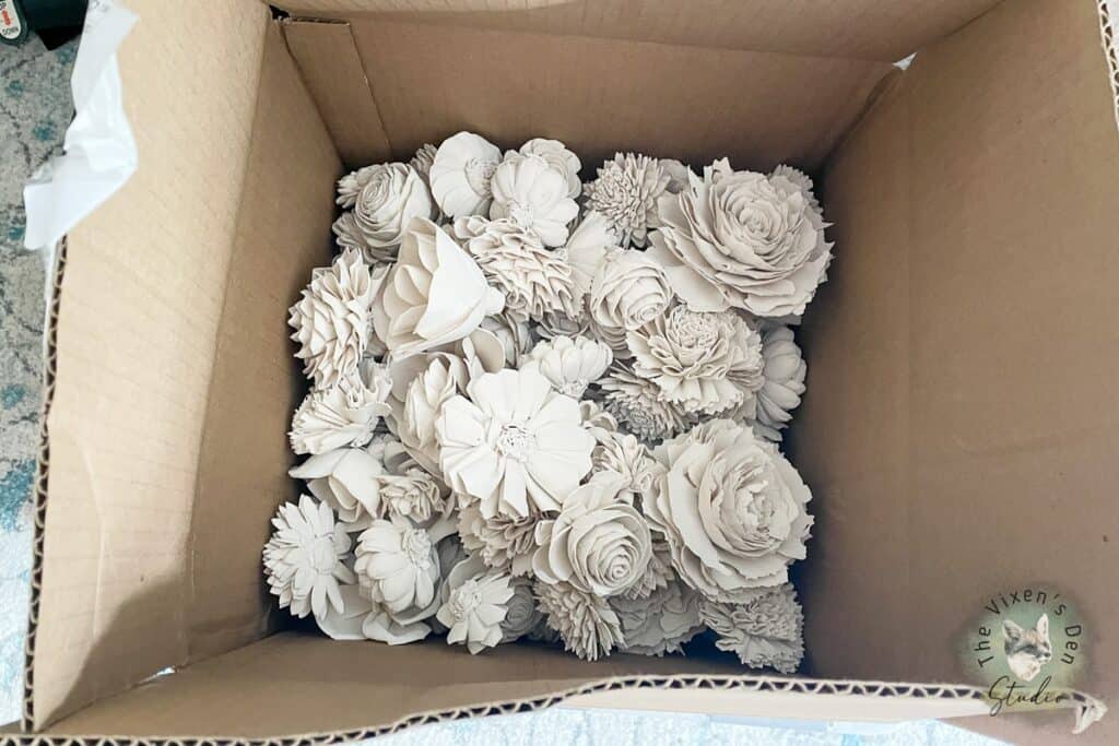 Dyed Sola Wood Flowers Stored in a cardboard box