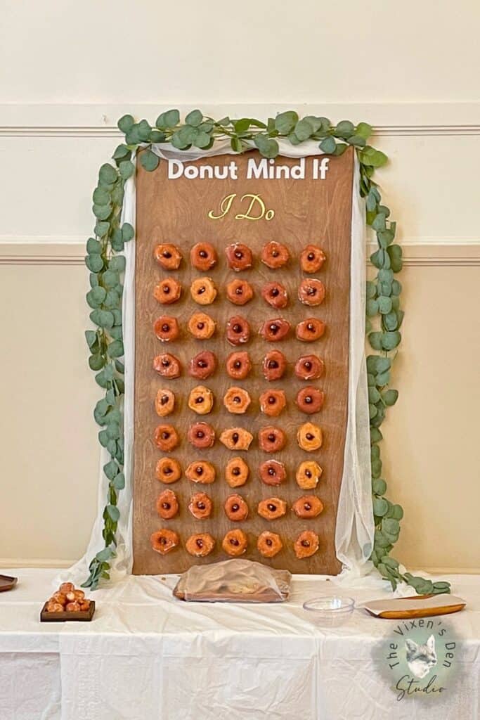 Donut board with donuts and a green vine