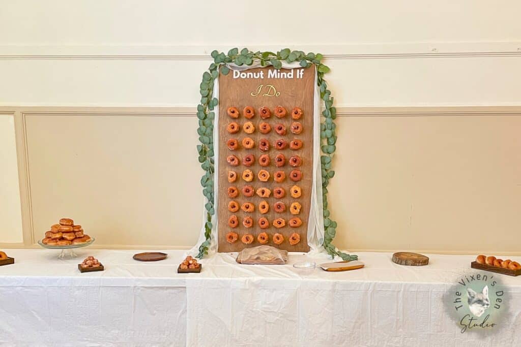 A wooden board with donuts on it.