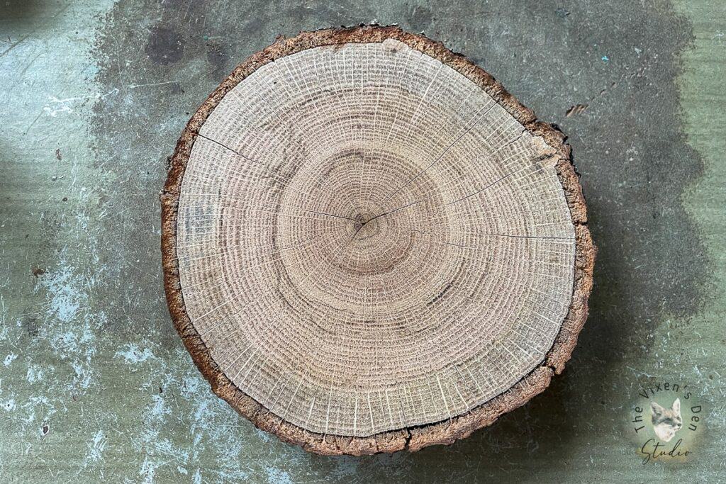 A piece of wood with a circle cut out of it.