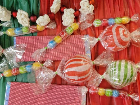 Candy canes and lollipops on a table.