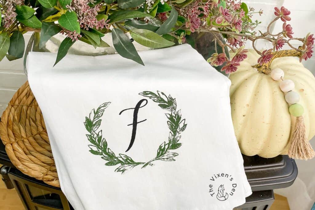 A tea towel with the letter f on it.