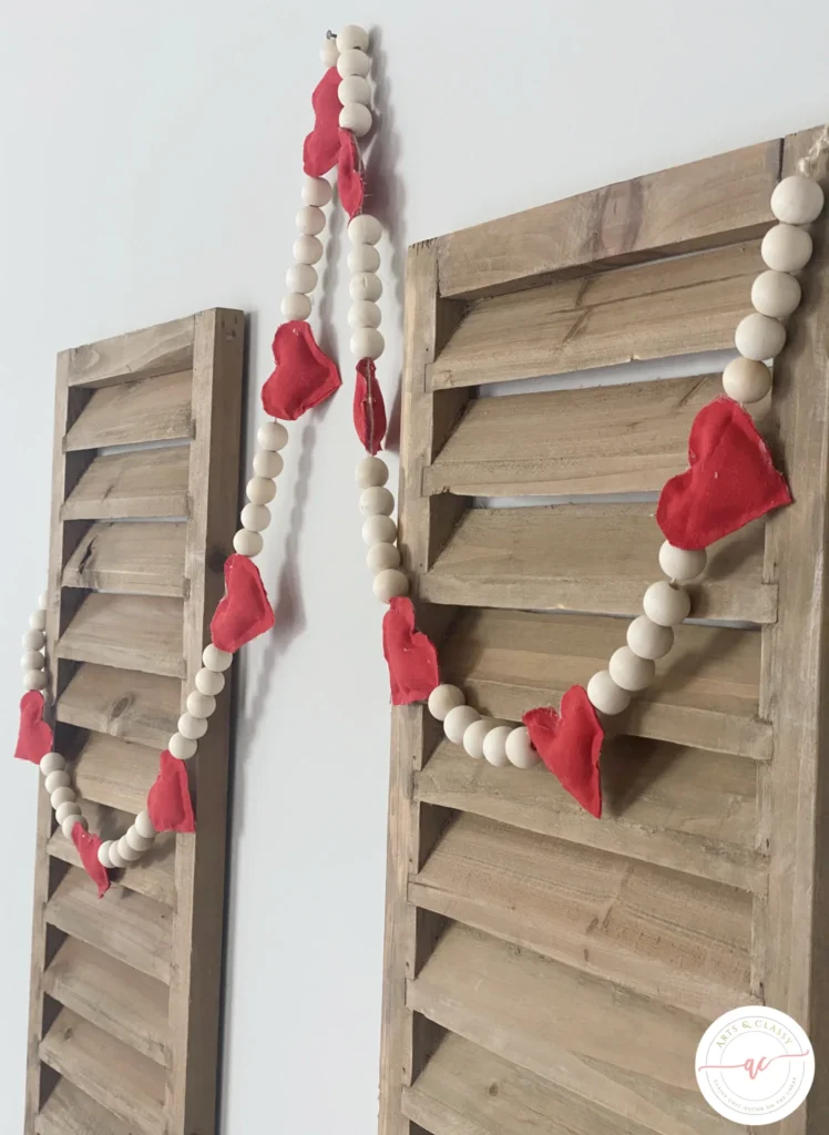 Valentine's day heart garland with wooden shutters.