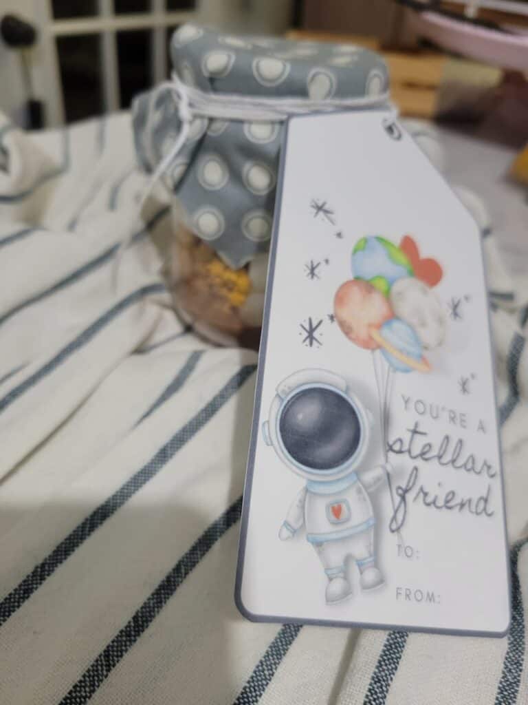 A gift tag with an astronaut on it.