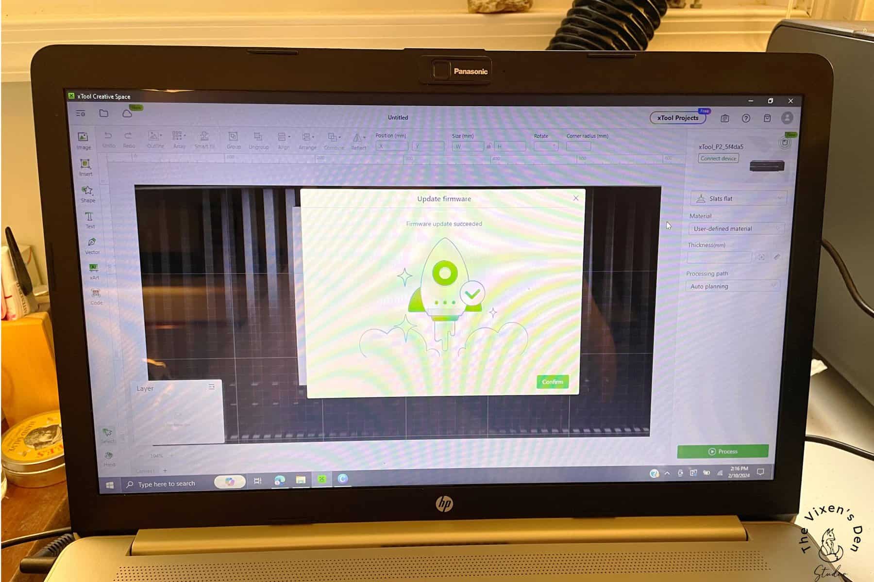 A laptop with a green screen on it.