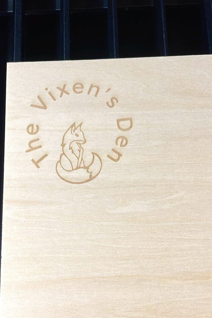 A wooden box with the fox's den logo on it.