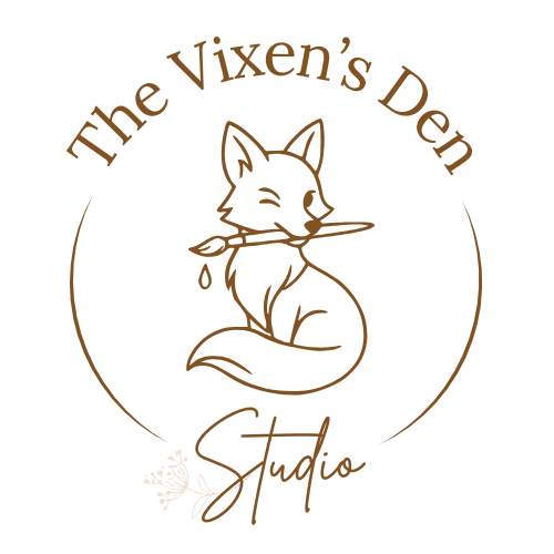 Logo for "The Vixen’s Den Studio" featuring a line drawing of a fox holding a paintbrush in its mouth, surrounded by circular text and accents.